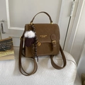Vintage brown leather backpack with plush pendant and metal buckle in retro style - Brown (With Charm)