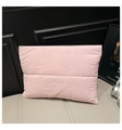Detail shot of a light pink quilted tote bag showing high-quality fabric and puffy texture - Pink
