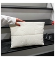 Detail of white quilted nylon clutch bag with square stitching and zip top closure - White