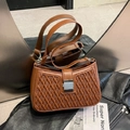 Retro brown leather shoulder bag featuring woven texture and silver metal buckle clasp - Brown