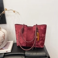 Detail view of burgundy tote bag with pleated velvet texture and wooden bead pendant - Bag And Charm / Burgundy