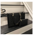 Detailed view of leopard print tote bag with faux fur trim and gold metal chain strap - One Size / Black