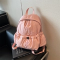 Light pink nylon backpack featuring a drawstring front pocket and high-quality textures - Pink