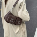 Brown lychee leather shoulder bag with vintage buckles and half-moon baguette shape - Coffee