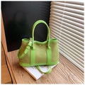 Detail of green suede and leather bucket bag featuring metal magnetic buckle on books - S / Green