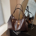 Deep brown oil wax leather tote bag with adjustable straps and silver hardware detail - Coffee