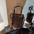 Leopard print bucket bag for women with brown leather trim and golden logo detail - With Charm / Coffee