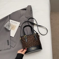 Fashionable leopard print bucket bag with black leather trim and gold buckle details - No Pendant / Black