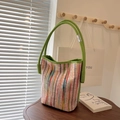 Colorful striped knit bucket bag with vibrant green leather handle and silver metal accents - Green