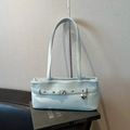 Light blue minimalist shoulder bag with silver buckle strap and heart charm detail - Blue