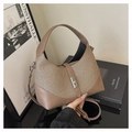 Close-up of contrast leather and woven fabric textures on the vintage crossbody bag - Khaki