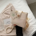 Chic cream-colored crossbody bag with wooden buckle and decorative floral silk ribbon tag - Off White