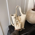 Minimalist ivory white bucket bag with pebble leather texture and mini pouch set - White