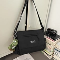 Black minimalist messenger bag with cute dinosaur pendant and adjustable strap - With Pendant / Black