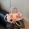 Pink cylindrical crossbody bag with bow decoration and heart-shaped mirror pendant - Pink
