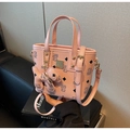 Pink pebbled leather mini bucket bag with cartoon bear print and gold hardware detail - With Pendant / Pink