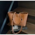 Caramel brown pebbled leather tote bag with gold logo and long shoulder straps - Brown