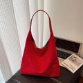Minimalist red faux suede hobo tote bag with a wide shoulder strap in a stylish setting - Large / Red