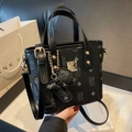 Black mini bucket bag with embossed bear pattern and adjustable strap in a gift box - With Pendant / Black