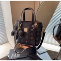 Dark brown monogram bucket bag with bear print, gold hardware, and matching bear charm - With Pendant / Coffee