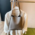 Taupe bucket bag in lychee pattern leather with dual straps for daily commuting - Gray