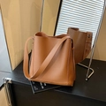 Chic brown litchi leather bucket bag for women with wide shoulder strap and spacious interior - Brown