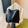 Classic black litchi pattern leather bucket bag with a wide shoulder strap for women - Black