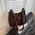 Dark brown leather bucket bag with lychee texture and adjustable shoulder straps - Brown