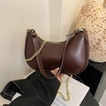 Dark brown crescent underarm bag in glossy PU leather with gold chain and leather strap - Brown