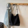 Large black minimalist suede tote bag with adjustable strap and smooth leather base details - Black