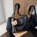 Black vintage leather tote bag with chain detail and plush bear charm decoration - Black