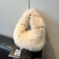 Fuzzy cream faux fur handbag with plush texture and round handle for winter style - Khaki