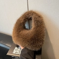 Brown faux fur dumpling handbag with fluffy texture and warm winter fashion style - Brown