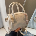 Mini cream Boston handbag in smooth PU leather with golden hardware and pink bead charm - Off White