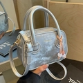 Silver textured crossbody bag with top handles and fashion lettering in a variant view - Silver