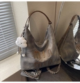 Detail of grey tote bag with min min leather patch and white plush cloud charm - With Charm / Dark Brown