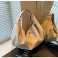 Close-up of beige suede hobo bag with a minimalist half-moon silhouette and zipper - Off White