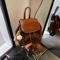 Dark brown leather patchwork backpack with magnetic flap and baseball charm detail - Brown with Pendant