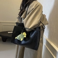 Minimalist black faux leather tote bag with a turtle plush charm on a shoulder strap - Black with Pendant