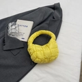Vibrant yellow quilted cloud handbag with stylish puffed texture and mini tote design - Yellow