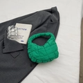 Quilted cloud bag in vibrant bright green color with a padded square pattern handle - Green