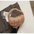 Chic camel quilted puffer handbag featuring a cloud-like texture and crescent design - Khaki