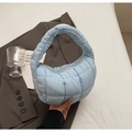 Chic light blue quilted cloud tote bag featuring a padded puffy design and soft texture - Light Blue