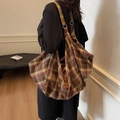 Brown and pink plaid hobo bag with metal ring strap detail for everyday commuting - Brown
