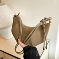 Khaki crescent crossbody bag featuring suede patchwork and knotted rope straps - Khaki