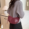 Women's burgundy crescent bag in premium faux leather featuring stylish shoulder strap - Red