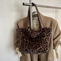 Faux fur leopard print tote bag with brown leather straps hanging on a metal rack - 25*24*10 / Coffee Without Pendant