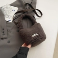Dark brown faux shearling bucket bag with CLEAR logo and adjustable shoulder strap - No Pendant / Brown