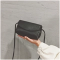 Minimalist black PU leather crossbody bag with lychee texture and round flap - Black