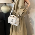 Creamy white box-style boston bag in pebbled leather with a silver ball charm - White